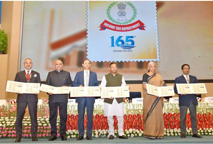 Union Minister Nirmala Sitharaman Releases Commemorative Stamp for 165th Income Tax Day.
