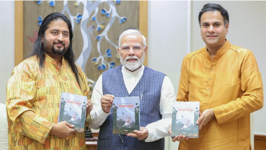 PM Narendra Modi unveils "Bharatvakya," a biography of classical musician Bharat Balvalli.
